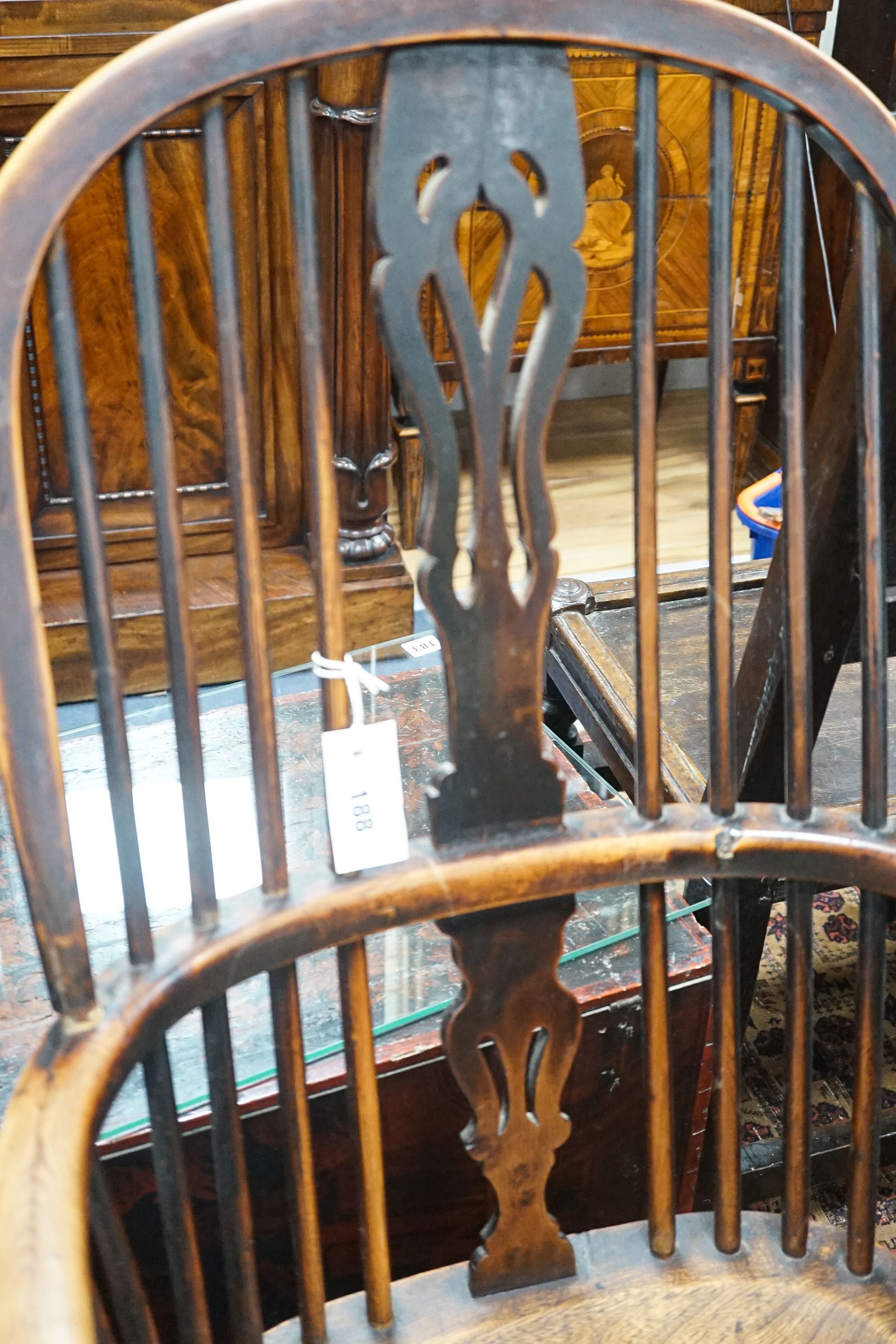 A 19th century Midlands area yew and elm Windsor armchair with crinoline stretcher, width 54cm, depth 40cm, height 108cm